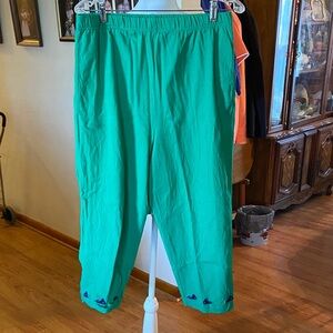 Women’s green capris with whales at the bottom of the legs